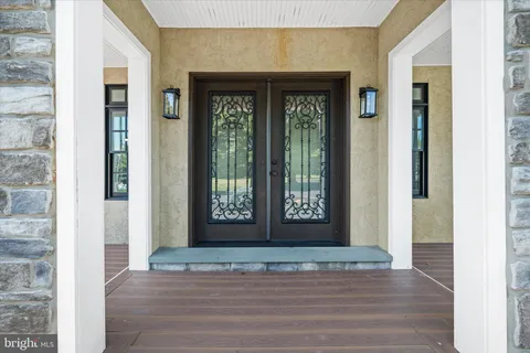 a view of a kitchen with a sink and chandelier