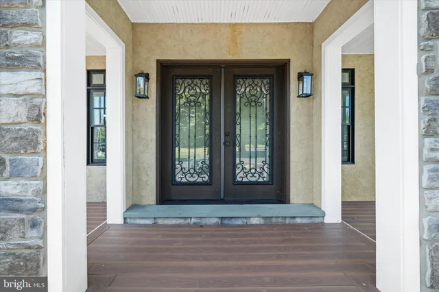 a view of a kitchen with a sink and chandelier