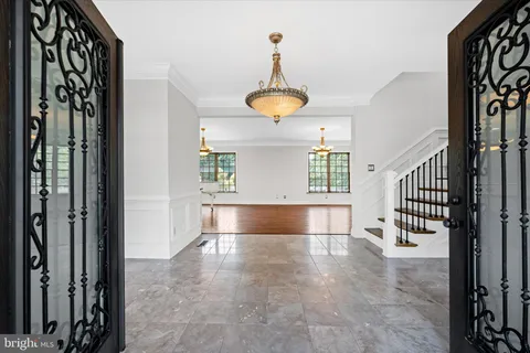 a view of a room with window and hardwood floor
