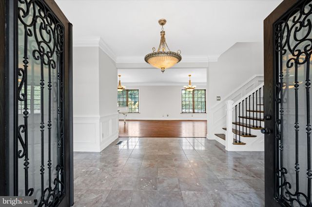 a view of a room with window and hardwood floor