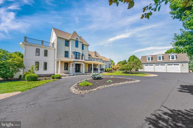 an aerial view of a house with a garden and plants