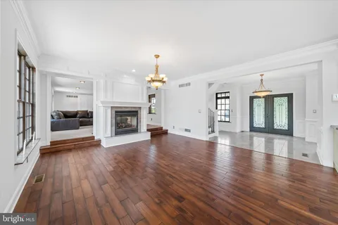 a view of a livingroom with furniture and a flat screen tv