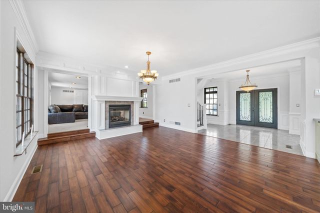 a view of a livingroom with furniture and a flat screen tv