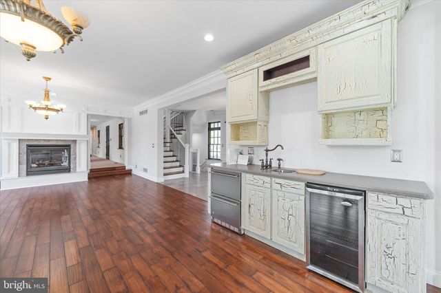 a view of washer and dryer with kitchen in the background