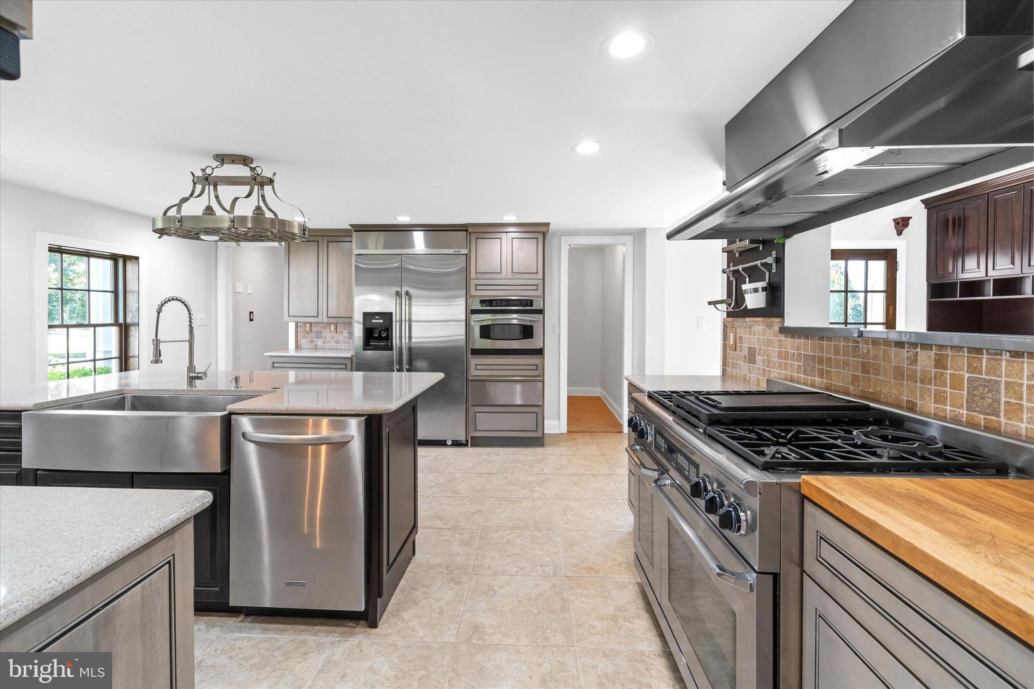 2159 McCoy Road Bear, DE 19701 - Photo 33 of 110 a kitchen with granite countertop a sink stove and cabinets