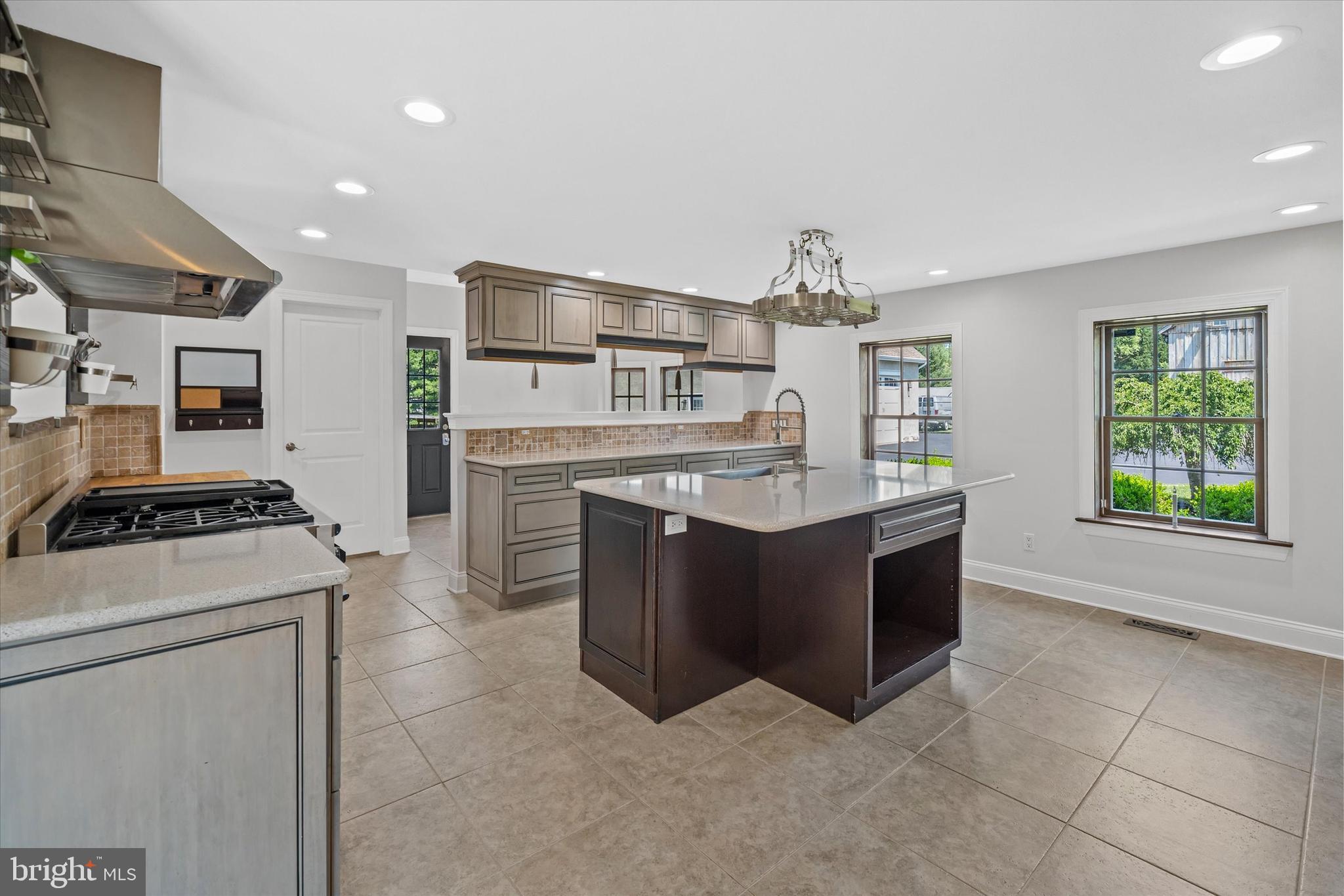 2159 McCoy Road Bear, DE 19701 - Photo 35 of 110 a kitchen with stainless steel appliances granite countertop a stove and a refrigerator