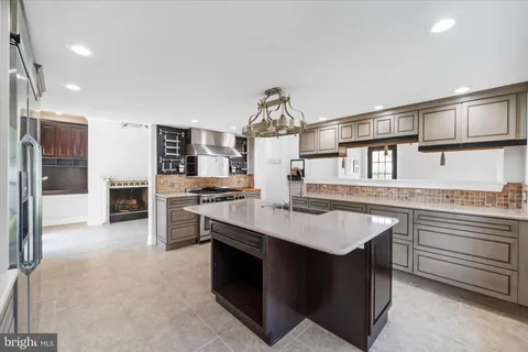 a view of a room with lots of cabinet and mirrors