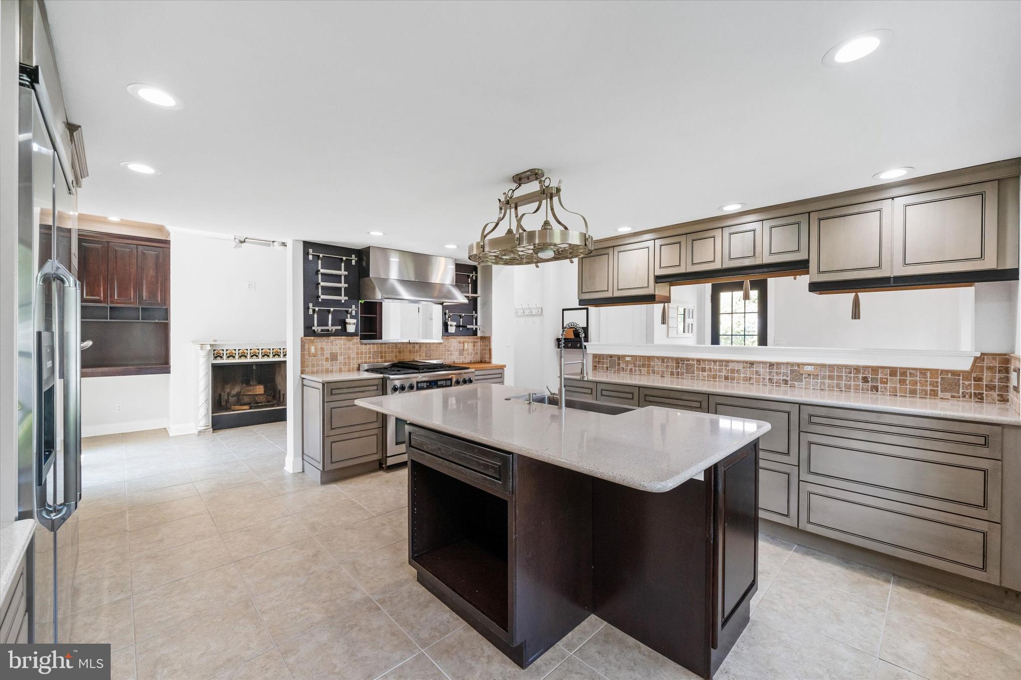 2159 McCoy Road Bear, DE 19701 - Photo 36 of 110 a kitchen with stainless steel appliances granite countertop a stove and a sink
