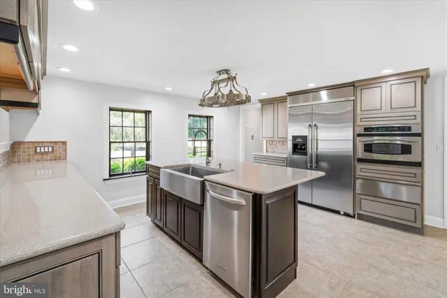 a view of a chandelier fan and windows