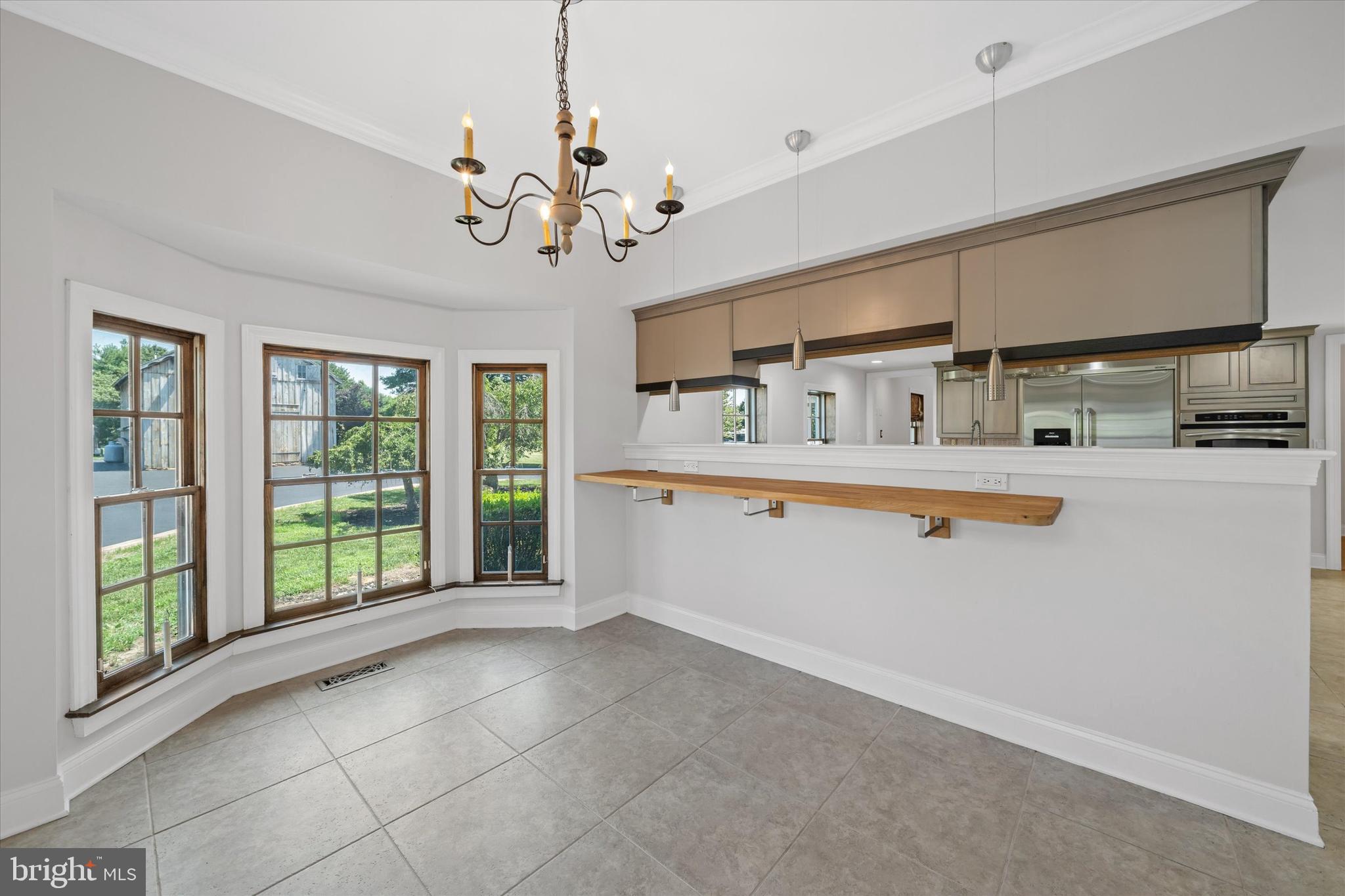 2159 McCoy Road Bear, DE 19701 - Photo 38 of 110 a view of a kitchen with a sink and chandelier