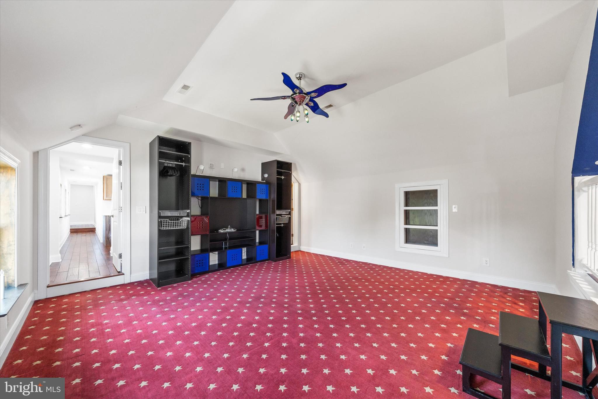 2159 McCoy Road Bear, DE 19701 - Photo 57 of 110 a bedroom with a large bed and a chandelier