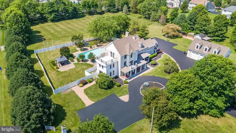 a view of a porch with wooden floor and floor to ceiling window