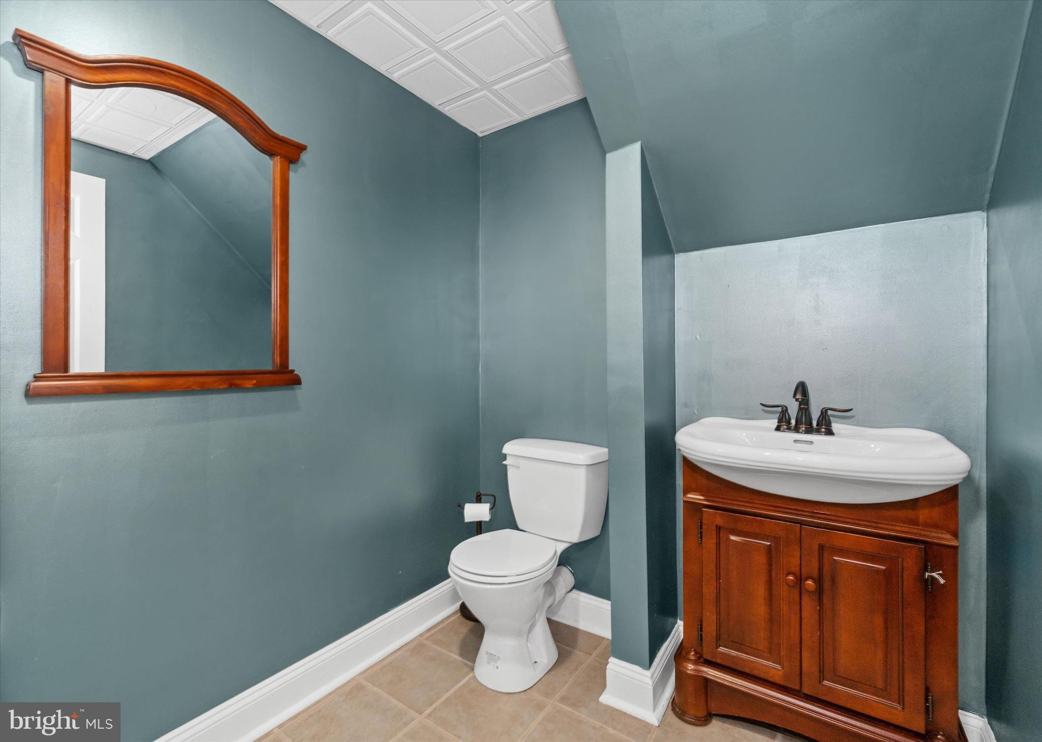 2159 McCoy Road Bear, DE 19701 - Photo 78 of 110 a bathroom with a toilet a sink and mirror