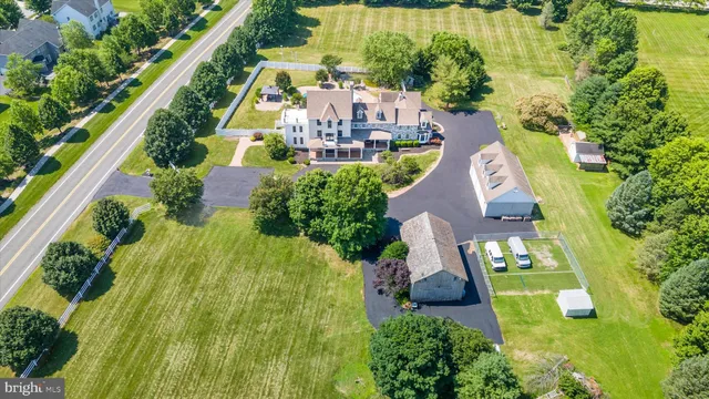 an empty room with fireplace wooden floor and windows