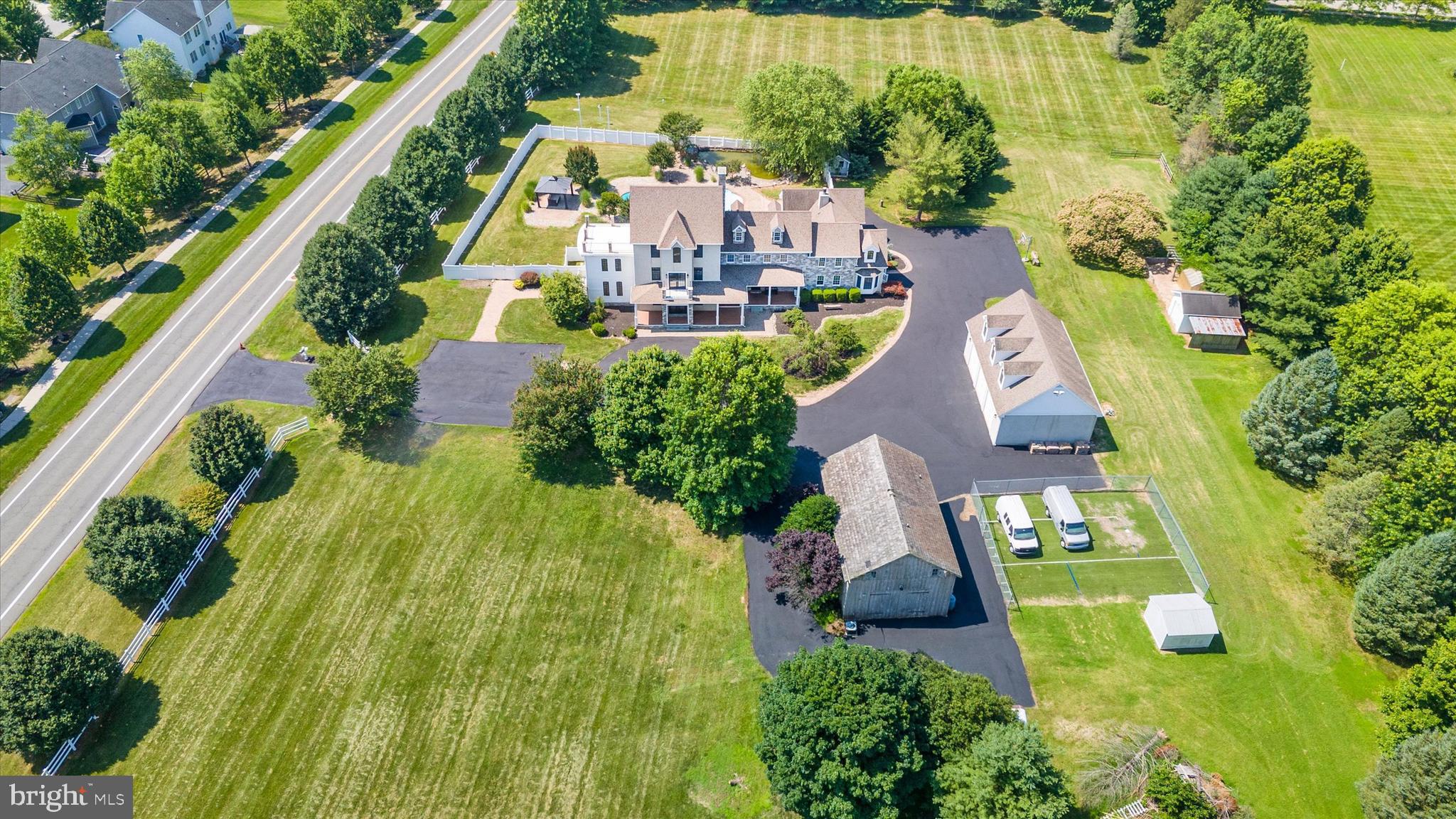 2159 McCoy Road Bear, DE 19701 - Photo 9 of 110 an aerial view of a house with a garden and swimming pool