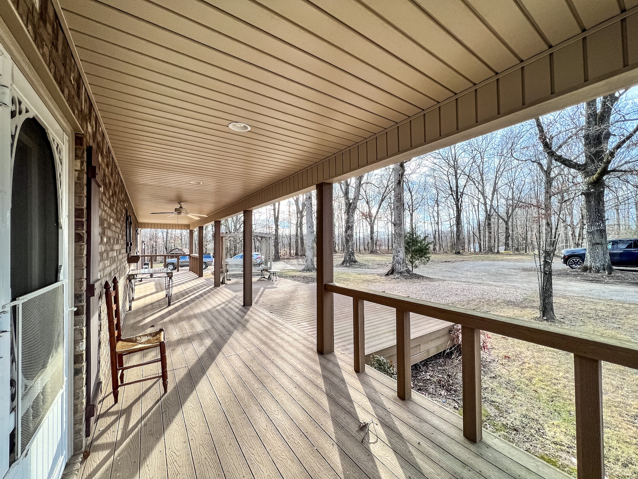 33 Hester Road Leoma, TN 38468 - Photo 8 of 52 a view of a porch with wooden floor and iron stairs