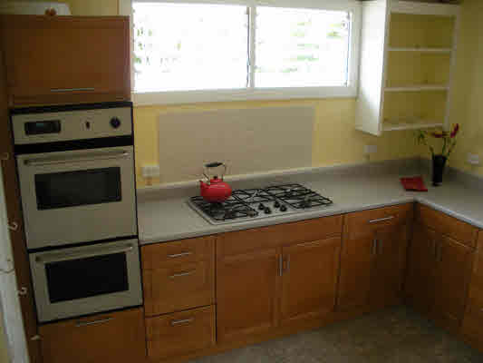 23-17 Kaiwiki Road Hilo, HI 96720 - Photo 8 of 18 a kitchen with a stove and a microwave