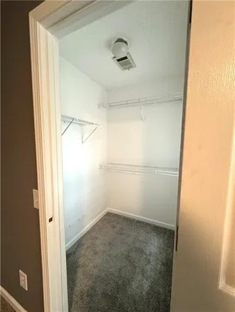 a large bathroom with a granite countertop sink and a mirror