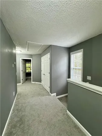 a view of an empty room and window