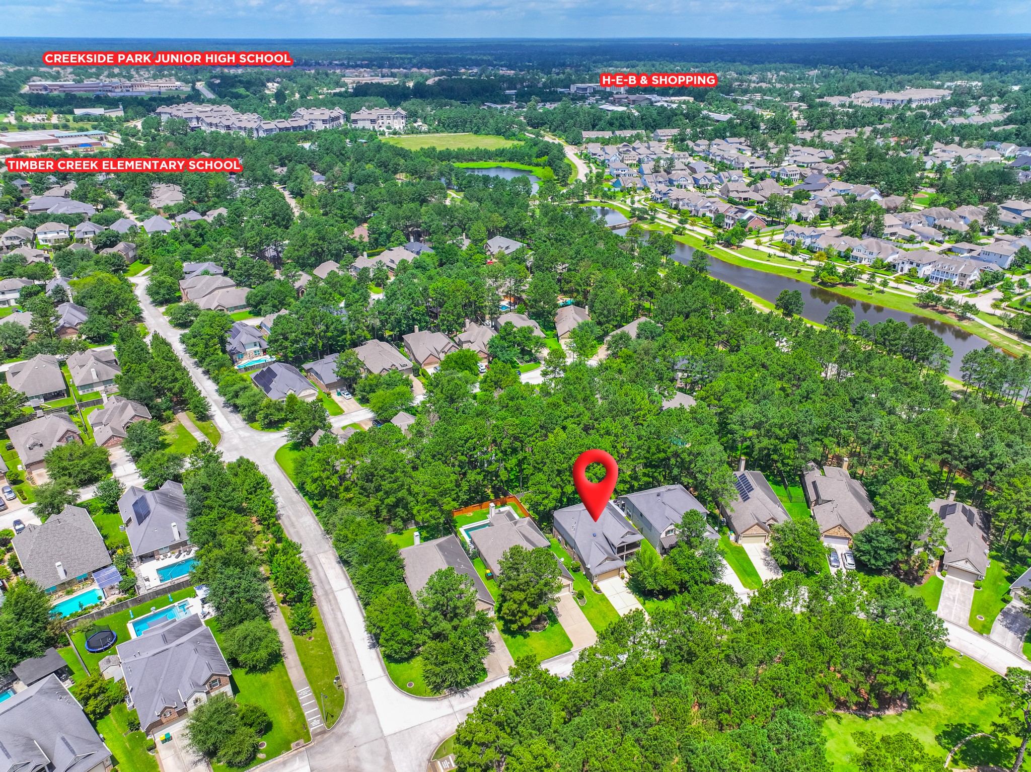79 West Jagged Ridge Circle Spring, TX 77389 - Photo 3 of 50 This aerial perspective highlights one of the property's biggest advantages — close proximity to Timber Creek Elementary and Creekside Park Junior High, plus convenient access to H-E-B and nearby shopping. It's the kind of location that makes daily life easier for the whole family.