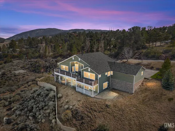 a view of park with large trees