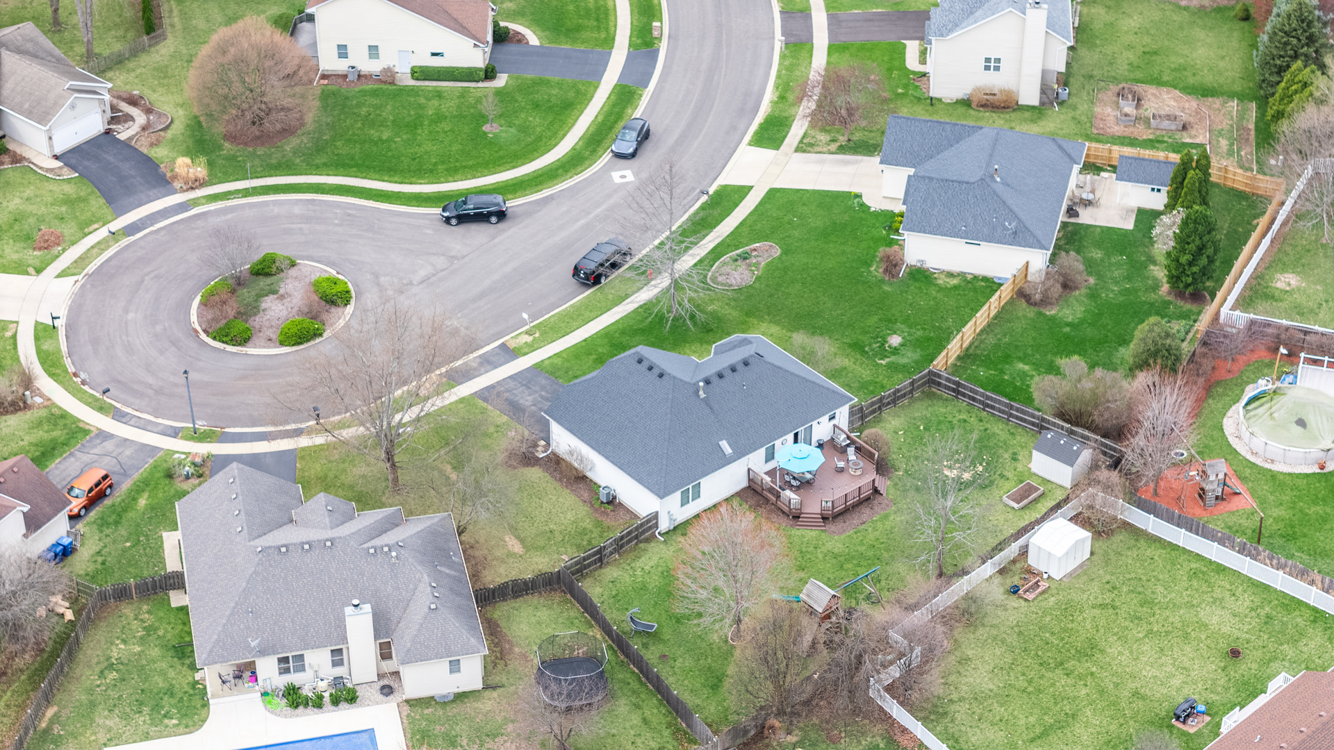 1277 Ryan Court DeKalb, IL 60115 - Photo 11 of 37 an aerial view of a house with outdoor space and a lake view