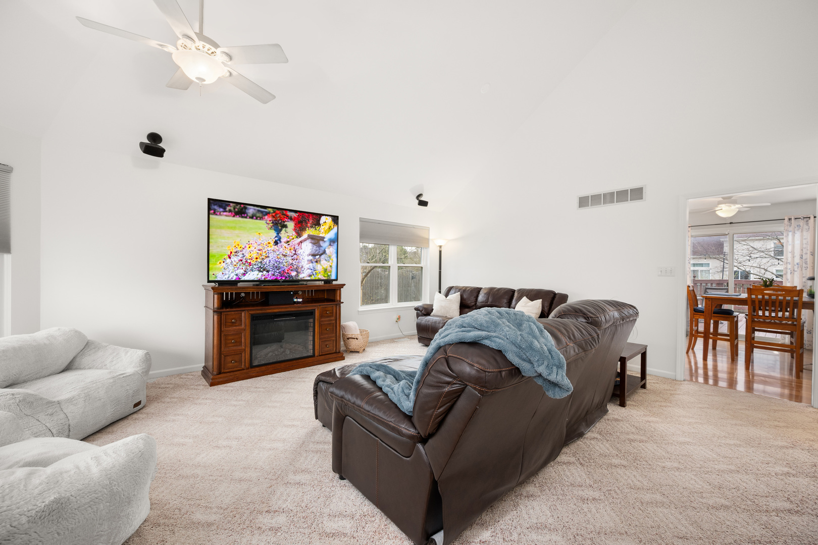 1277 Ryan Court DeKalb, IL 60115 - Photo 14 of 37 a living room with furniture and a flat screen tv