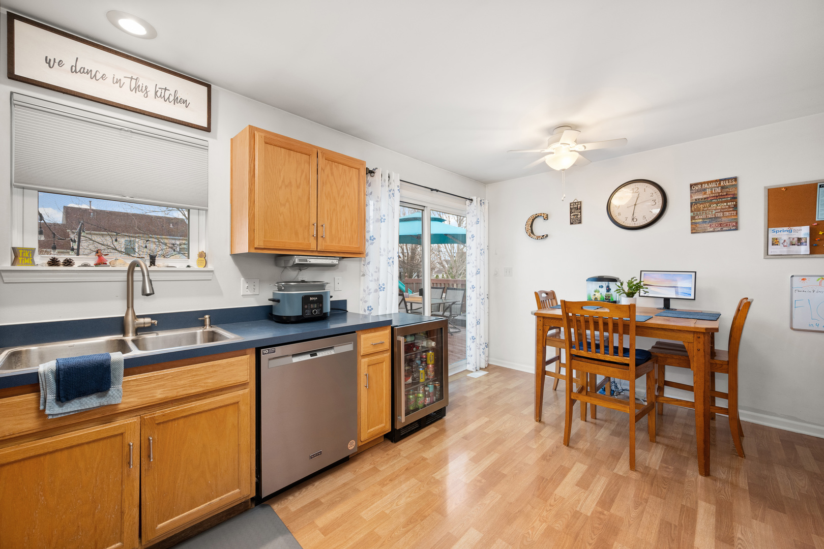 1277 Ryan Court DeKalb, IL 60115 - Photo 18 of 37 a kitchen with stainless steel appliances granite countertop a dining table chairs a sink and dishwasher