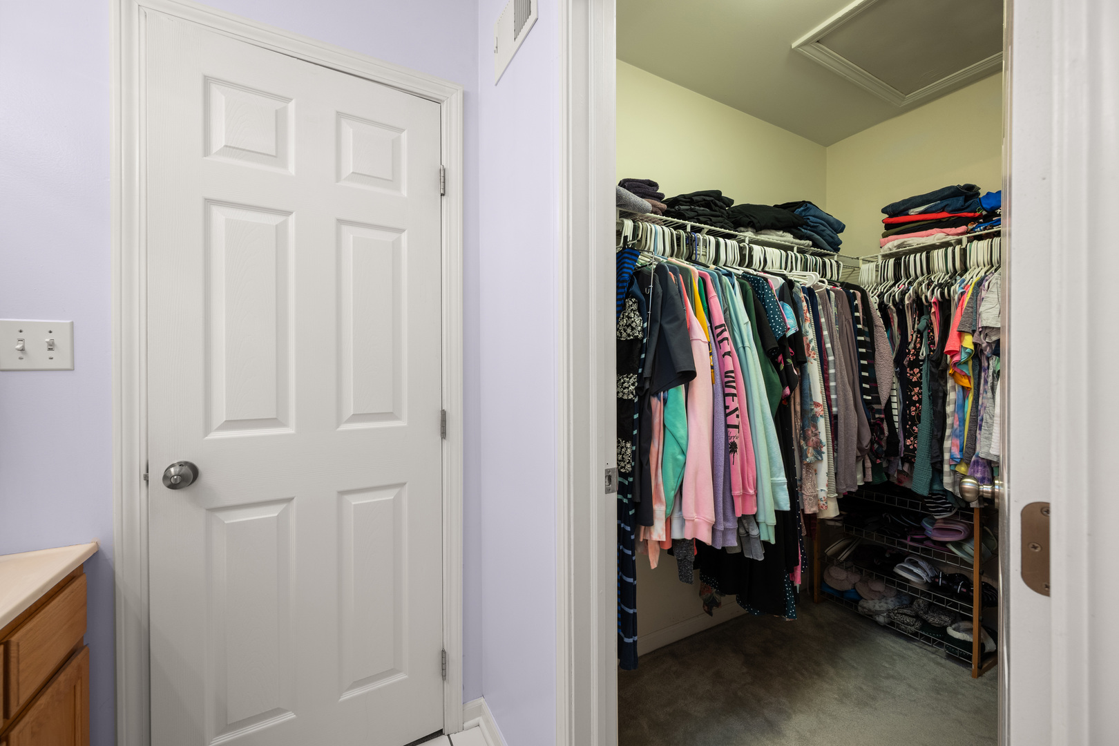 1277 Ryan Court DeKalb, IL 60115 - Photo 22 of 37 a view of walk in closet with clothes