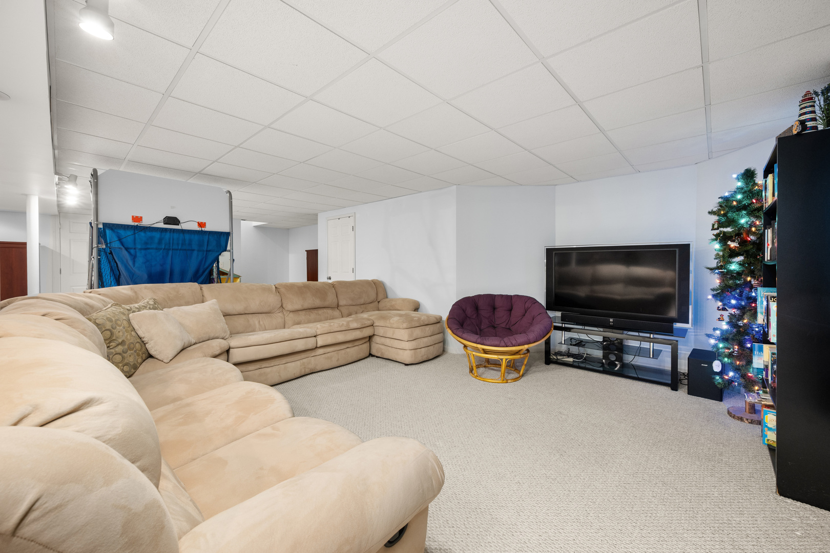 1277 Ryan Court DeKalb, IL 60115 - Photo 30 of 37 a living room with furniture and a flat screen tv