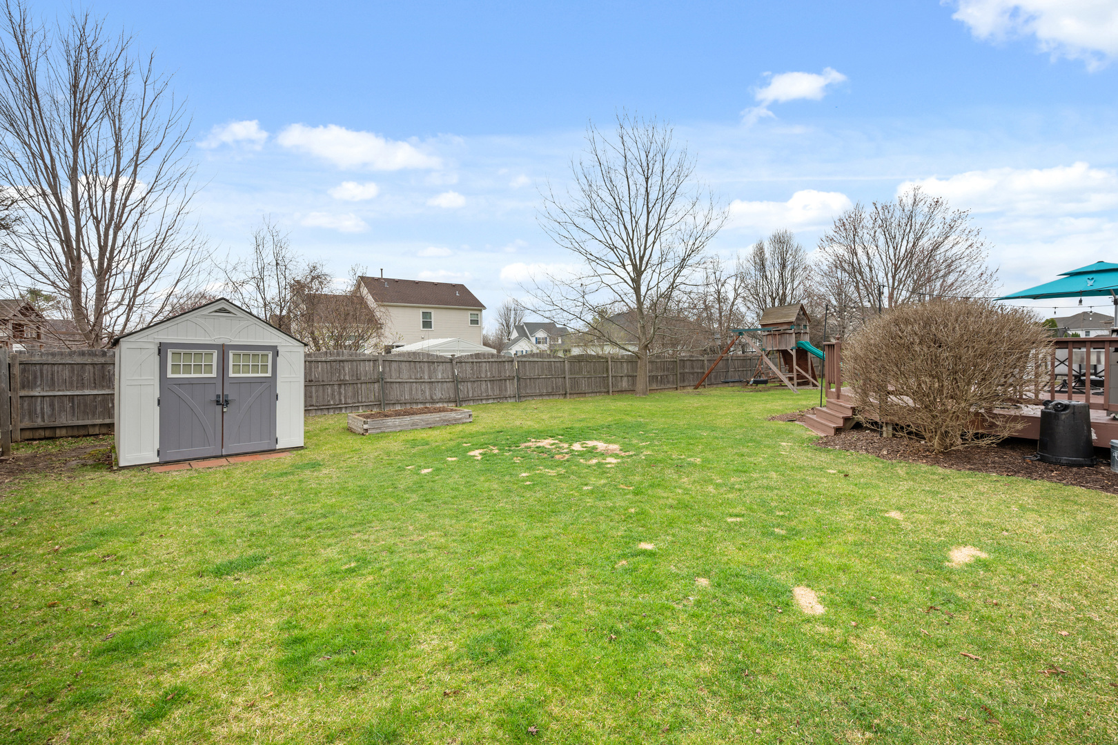 1277 Ryan Court DeKalb, IL 60115 - Photo 34 of 37 a front view of a house with garden