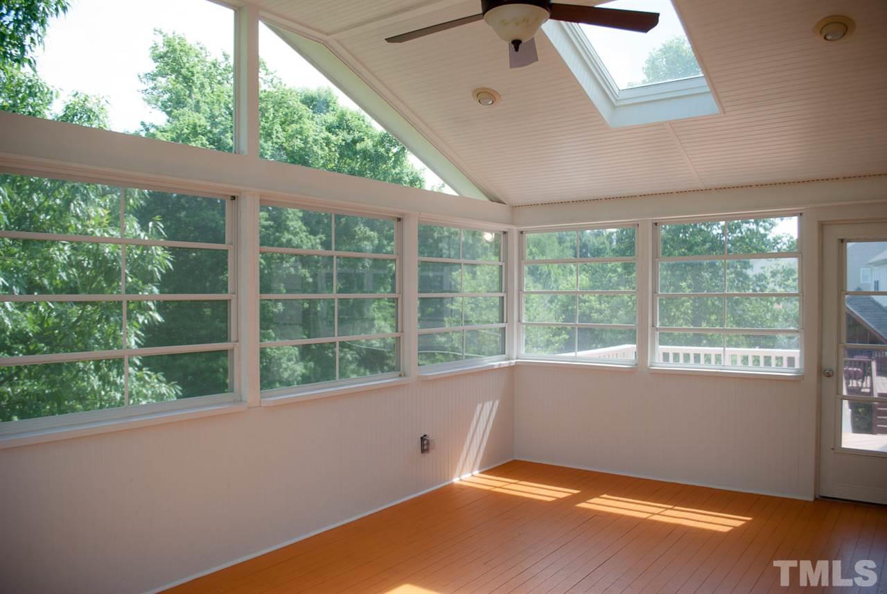2370 Spruce Shadows Lane Raleigh, NC 27614 - Photo 22 of 23 an empty room with wooden floor and windows