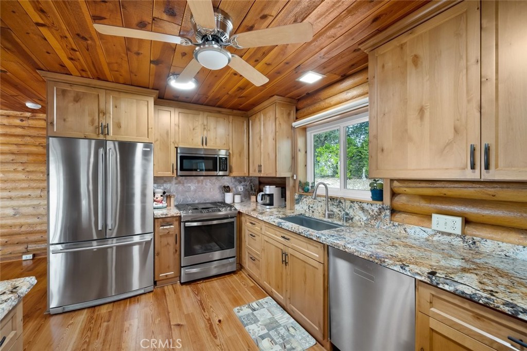 4620 Obispo Road Atascadero, CA 93422 - Photo 14 of 50 a kitchen with stainless steel appliances granite countertop a refrigerator a sink dishwasher a stove and a refrigerator