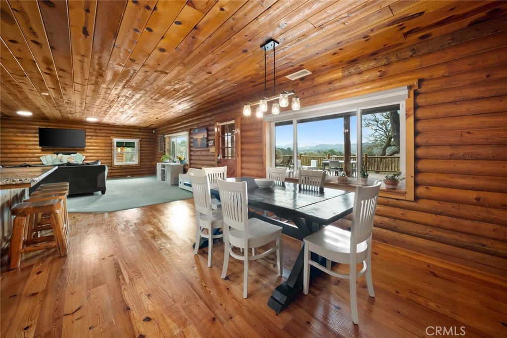 4620 Obispo Road Atascadero, CA 93422 - Photo 16 of 50 a view of a dining room with furniture window and wooden floor
