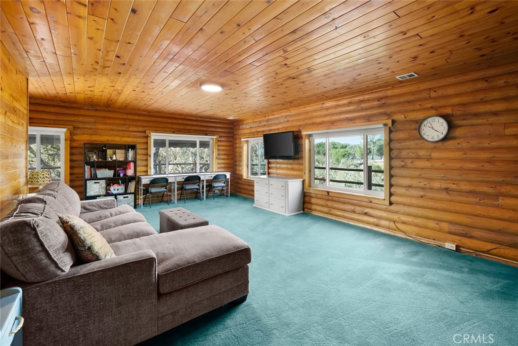 4620 Obispo Road Atascadero, CA 93422 - Photo 20 of 50 a living room with furniture and a flat screen tv