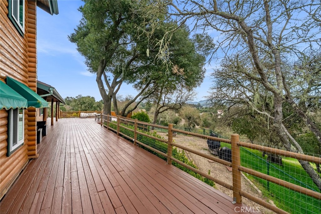 4620 Obispo Road Atascadero, CA 93422 - Photo 2 of 50 a view of a balcony with wooden floor and trees