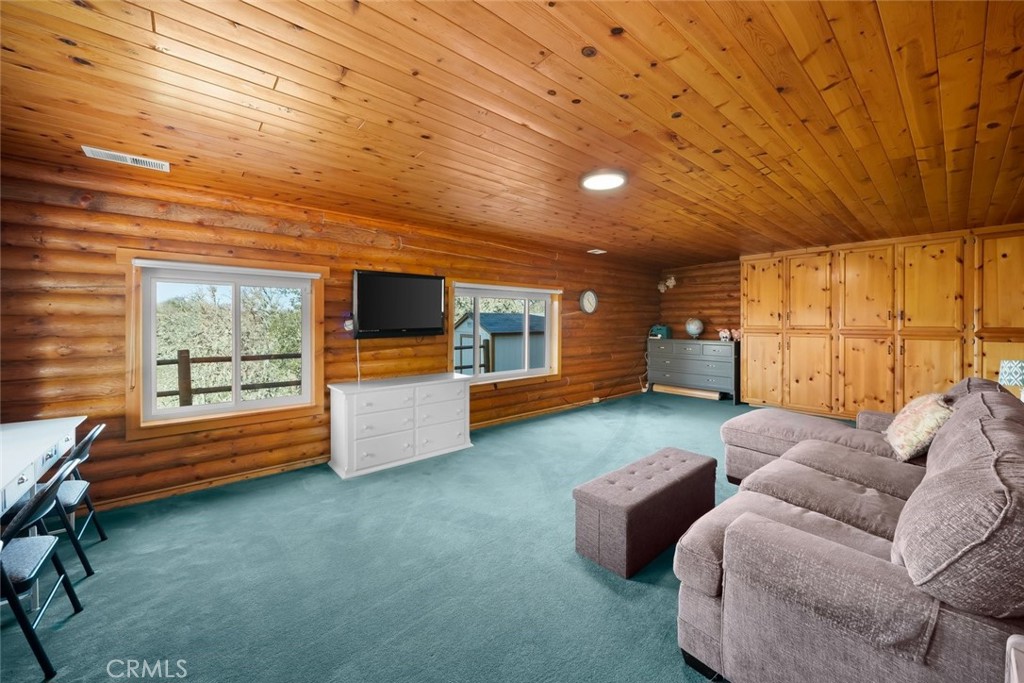 4620 Obispo Road Atascadero, CA 93422 - Photo 21 of 50 a living room with furniture and a flat screen tv