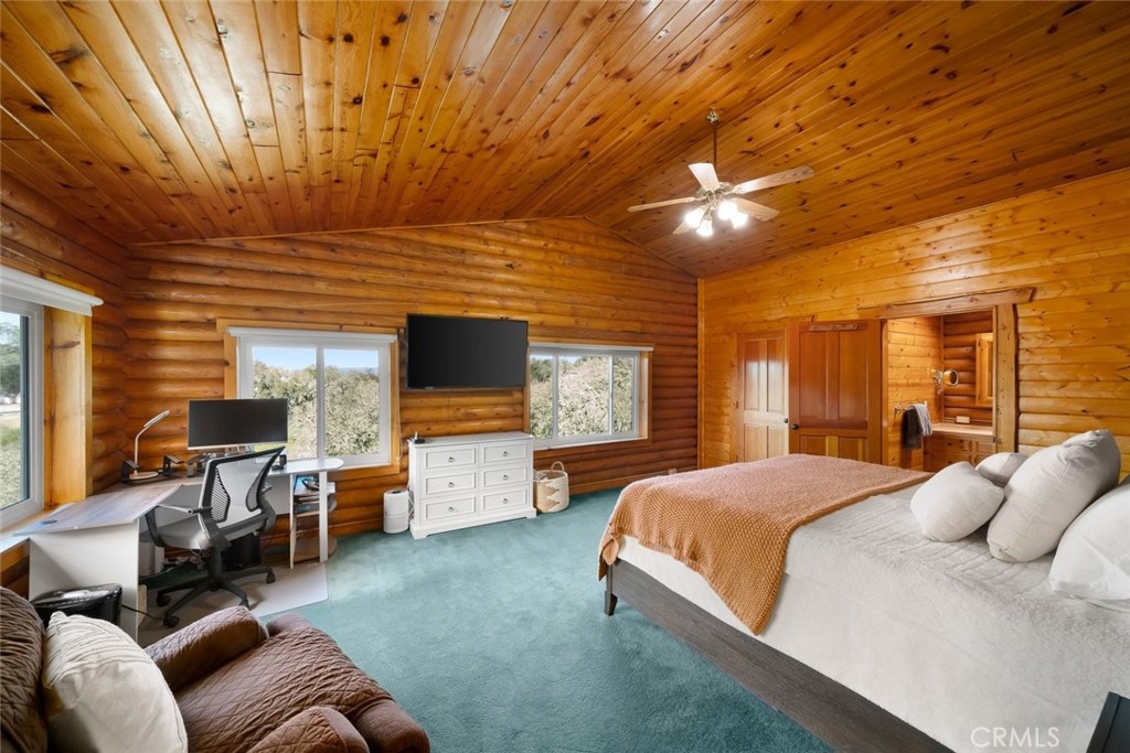 4620 Obispo Road Atascadero, CA 93422 - Photo 24 of 50 a spacious bedroom with a bed and large windows