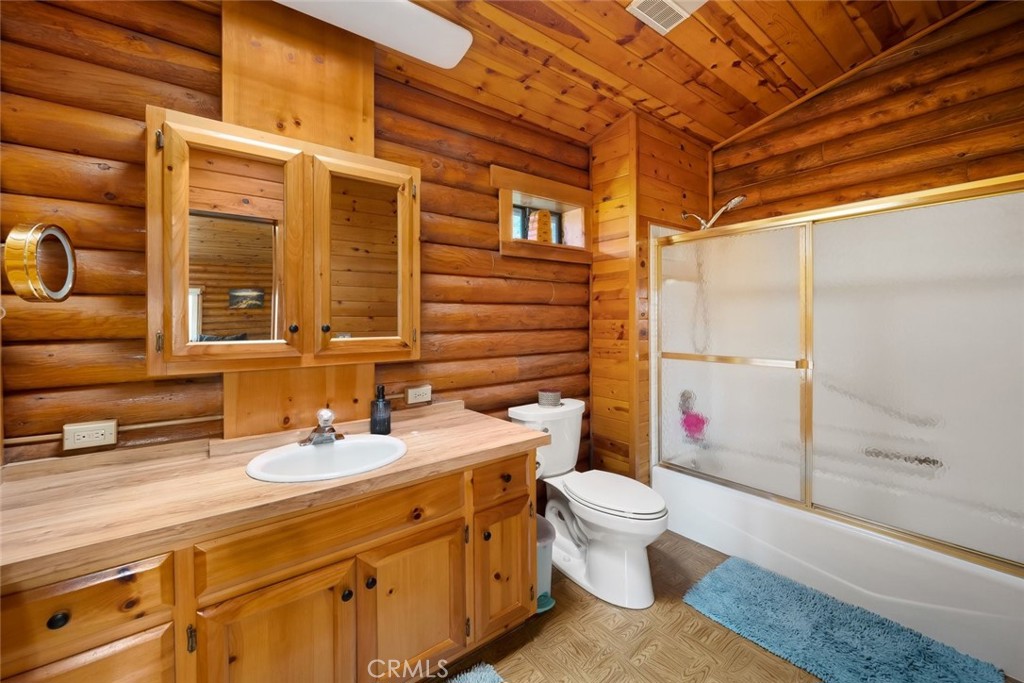 4620 Obispo Road Atascadero, CA 93422 - Photo 25 of 50 a bathroom with a sink and a mirror