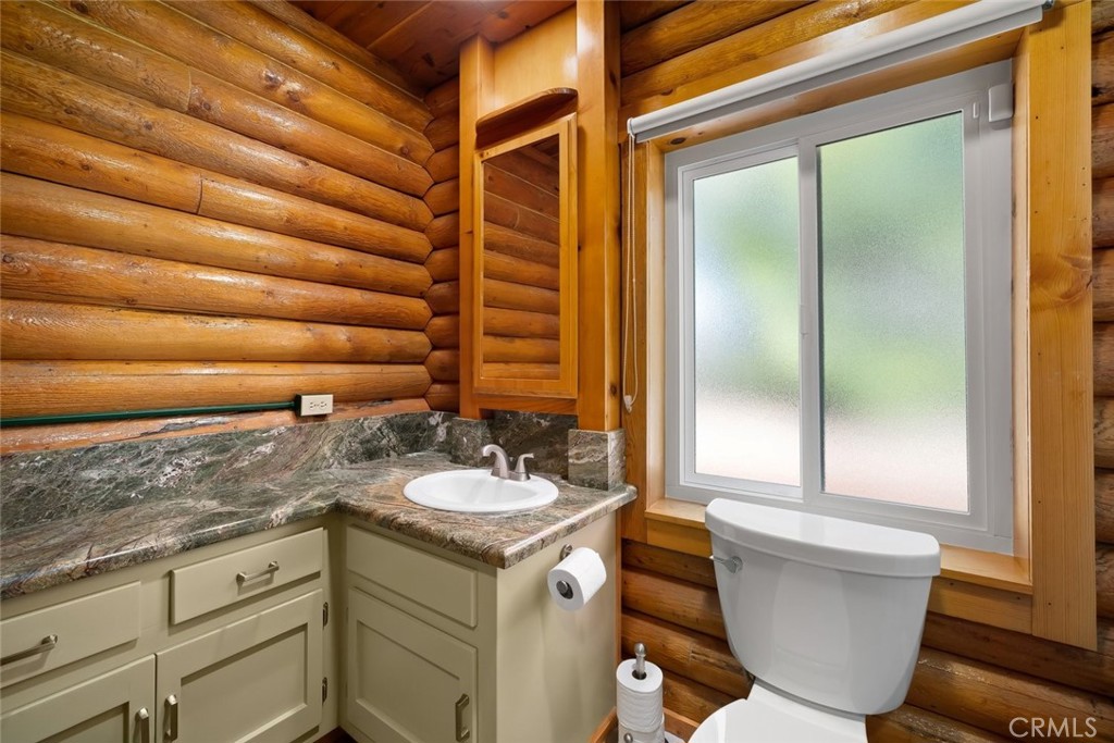 4620 Obispo Road Atascadero, CA 93422 - Photo 29 of 50 a bathroom with a granite countertop sink and a mirror