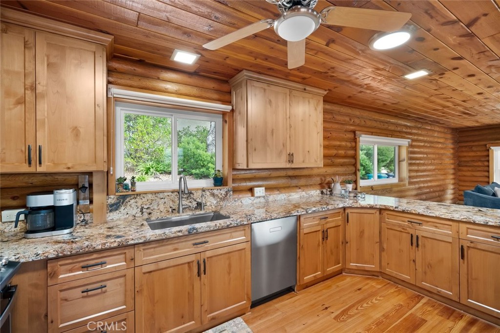 4620 Obispo Road Atascadero, CA 93422 - Photo 4 of 50 a kitchen with a sink window and cabinets