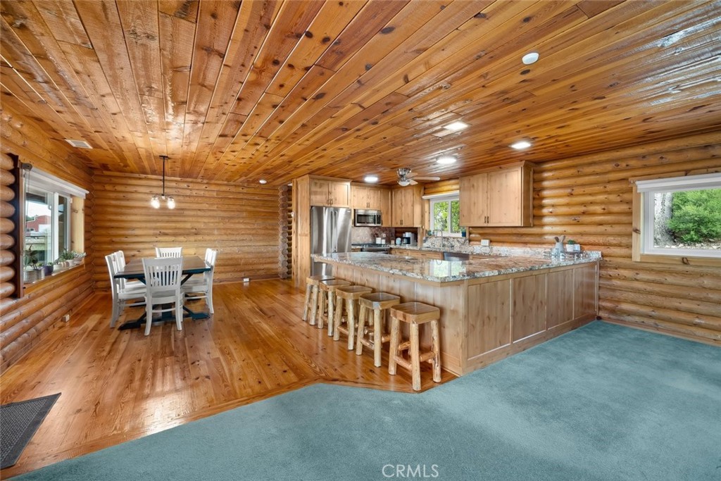 4620 Obispo Road Atascadero, CA 93422 - Photo 5 of 50 a kitchen with stainless steel appliances granite countertop a sink a stove and a wooden floors