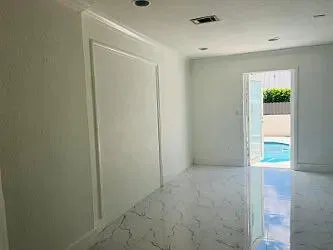 a bathroom with a shower and toilet