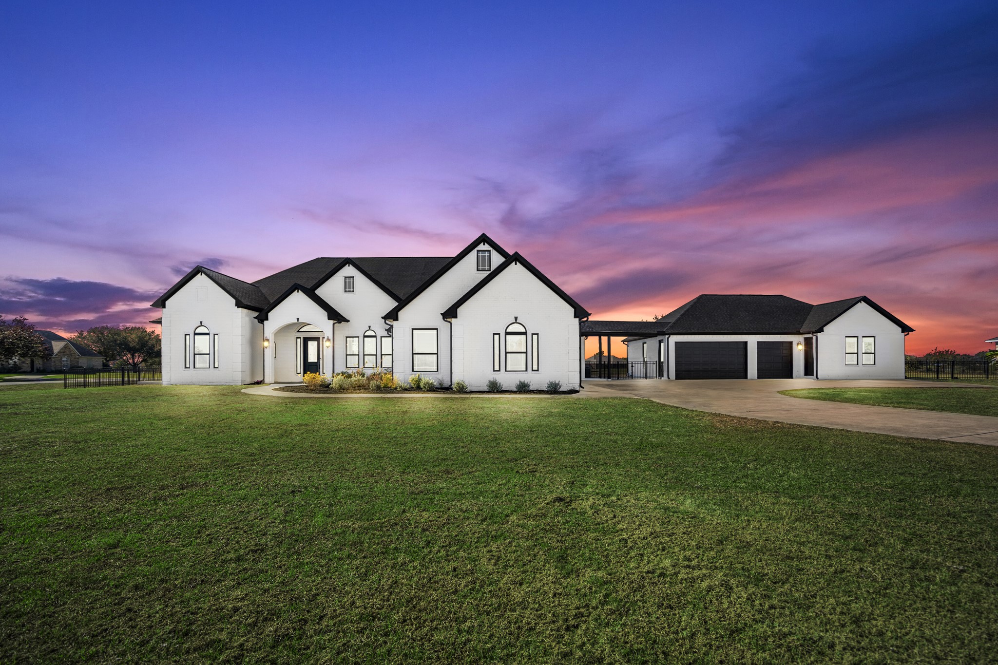 Welcome home! This stunning, remodeled, 1.5 story home welcomes you with a modern exterior with white painted brick and dark contrasting trim, and it sits on 1.15 acres giving plenty of space and privacy!