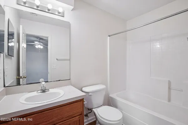 a bathroom with a sink a toilet and a bathtub