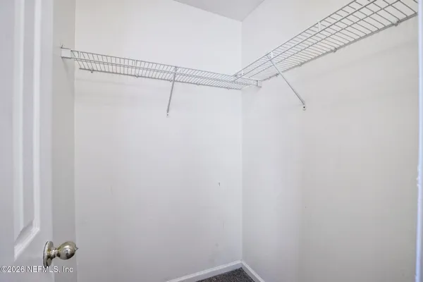 a view of a room with racks on the wall