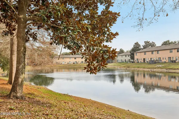 a view of a lake with a house