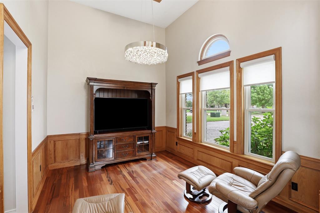 2406 River Road Granbury, TX 76048 - Photo 15 of 40 Vaulted ceiling featuring a contemporary chandelier