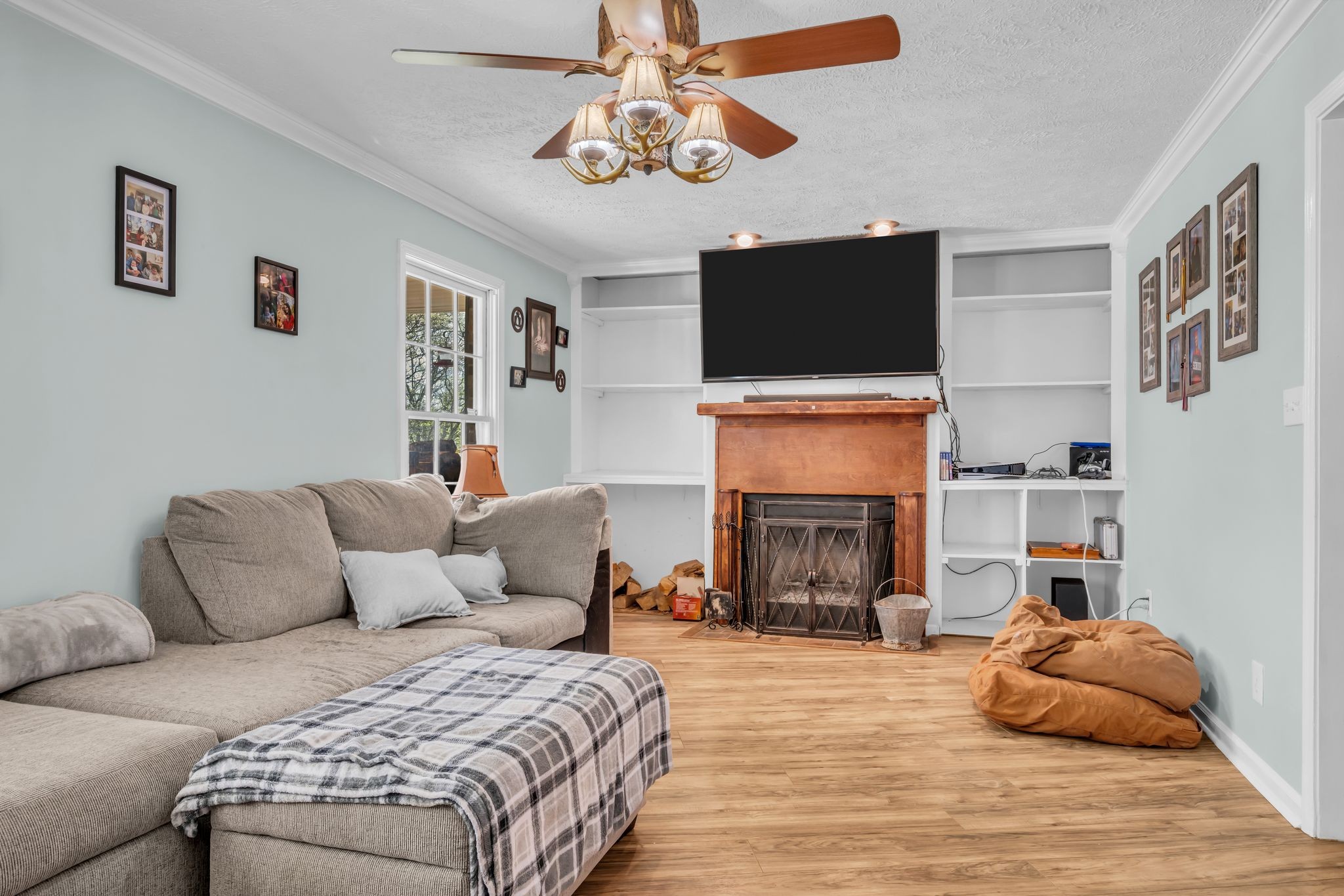 2025 Dunn Chapel Road Cumberland Furnace, TN 37051 - Photo 6 of 37 a bedroom with a bed and a fireplace