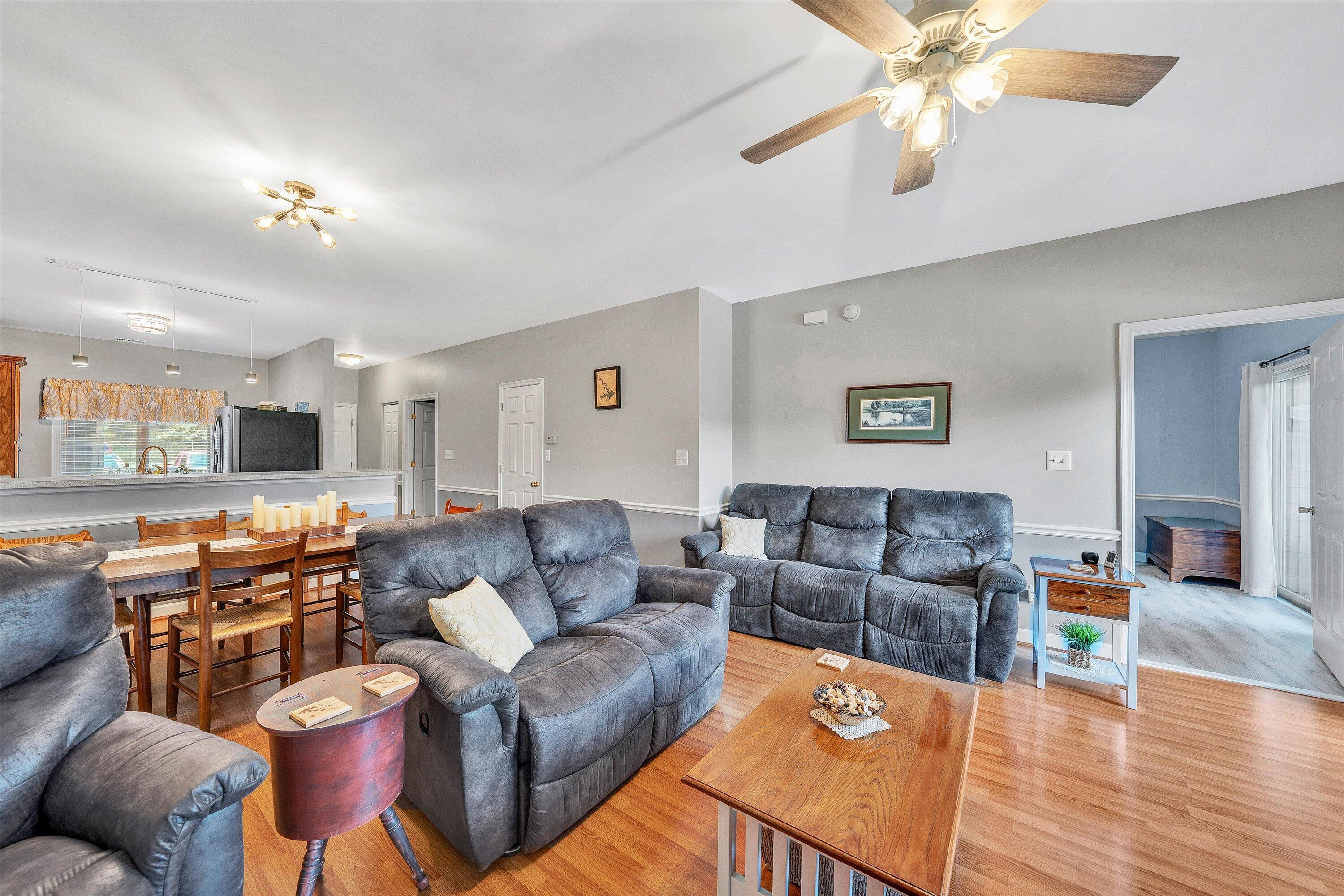 1175 Mariners Way, Unit 54 Huddleston, VA 24104 - Photo 16 of 37 a living room with furniture a couch and wooden floor
